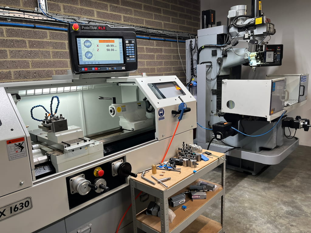 A CNC Mill and Lathe next to each other.